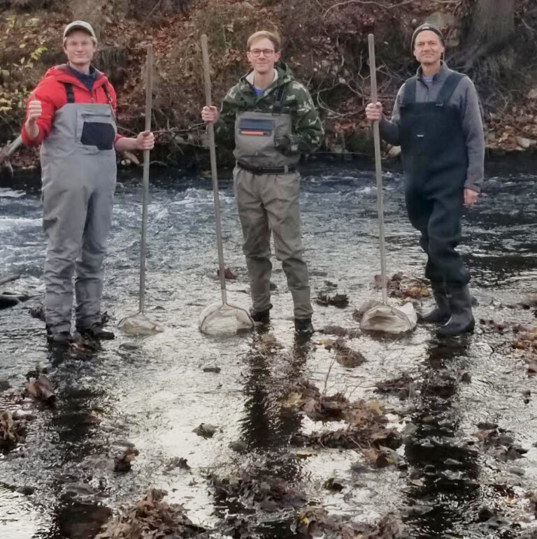 WMEAC staff member Kyle Hart (left) and Stream Keepers Josh and Mike (right) pose with their dip nets in Buck Creek.